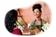 Florist wrapping up a bouquet of flowers for a customer.