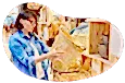 A customer examines a basket at a home decor shop.