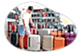 A customer looks over a selection of rolling luggage.