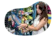 A customer examines a tennis racket at a sporting goods store.