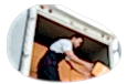 A driver unloads boxes from their box truck