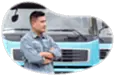 Trucking business owner looking over their fleet of trucks.