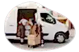A small business owner and their employee loading the company van with deliveries