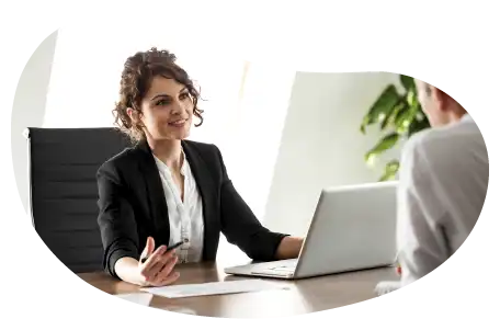 A small business owner discussing their professional liability coverage with a client